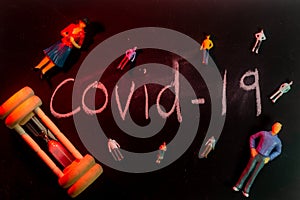 Covid-19 Coronavirus Concept  -  writing on black board with creative lighting. shallow depth of field