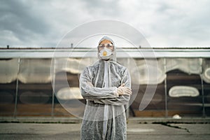 COVID-19 coronavirus doctor in hazmat suit.Infectious disease pandemic medical worker.Female physician in uniform on frontline,