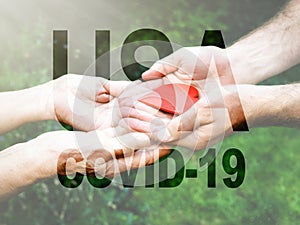 COVID-19 coronavirus. Fill text USA with old, young hands, red heart image cut.