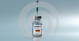 COVID-19 Coronavirus mRNA Vaccine and Syringe with flag of Germany on the label. Concept Image for SARS cov 2 infection pandemic