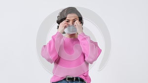 Covid-19 coronavirus protection. Woman wearing medicine mask and looking to camera on white background. Health care and m