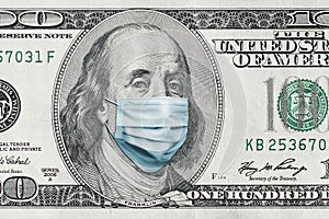 COVID-19 coronavirus in USA. Hundred golden dollar money bill with face mask.