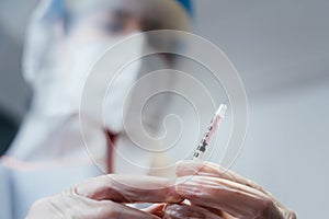 COVID-19 coronavirus vaccine. Doctor prepared to vaccinate the patient against Covid.