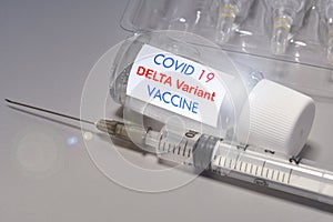Covid-19 Delta variant strain vaccine. Syringe and vaccine. Treatment for coronavirus covid-19