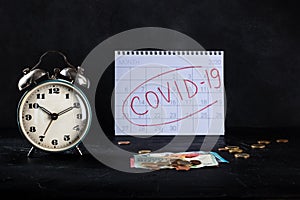 Covid 19 impact on European economy, economical consequences of lockdowns. A clock, monthly calendar and money in euros