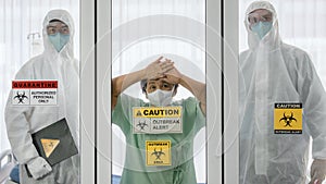 Covid-19 infected patient in quarantine room with quarantine and breakout alert sign at hospital with bed and disease control