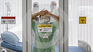 Covid-19 infected patient in quarantine room with quarantine and breakout alert sign at hospital with bed and disease on control