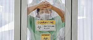 Covid-19 infected patient in quarantine room with quarantine and breakout alert sign at hospital with blurred disease control