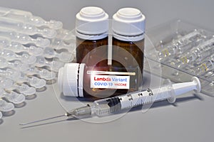 Covid-19 Lambda variant strain vaccine. Syringe and vaccine. Treatment for coronavirus covid-19