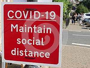 COVID-19 Maintain Social Distance Sign with People