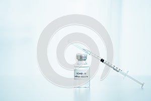 COVID-19 mRNA cure vaccine and needle.