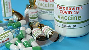 Covid-19 and ncov coronavirus vaccine, tablets and syringe. Laboratory, analyzes a colored liquid to extract the DNA and