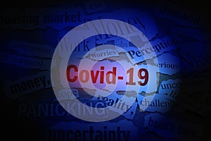 Covid 19 newspaper headlines with related news items around it ---- Corona Virus impact concept