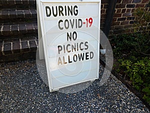 During covid 19 no picnics allowed information sign