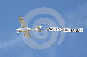 Covid-19 novel disease aeroplane plane aircraft sign notice warning public health wash your hands