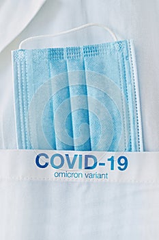 COVID-19 omicron variant, medical protective face mask in white coat pocket