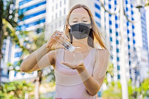 COVID-19 Pandemic Coronavirus. Woman hands using wash hand sanitizer gel dispenser, against Novel coronavirus 2019-nCoV