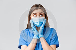 Covid-19, preventing virus, health, healthcare workers and quarantine concept. Close-up of shocked and surprised female