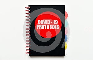 Covid-19 Protocols. Handbook with Covid-19 Protocols isolated on white background