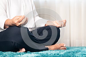 Covid-19 quarantine activity for senior woman meditating stay home to avoid risk