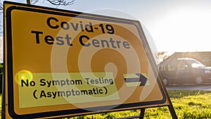 Covid-19 sign outside a walk-in test center non-symptomatic