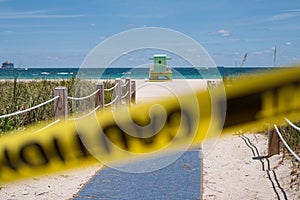 Covid 19, social lockdown in US, America. Lifeguard cabin on empty beach. Miami Beach, Florida, USA. Beach closed