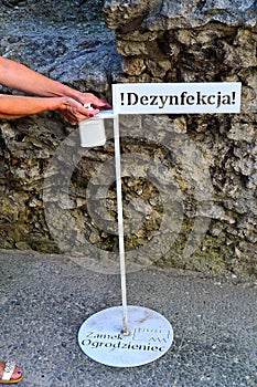 Covid-19, a stand for hand disinfection before a tour of the castle ruins of Ogrodzeniec, Poland