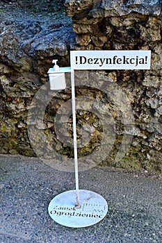 Covid-19, a stand for hand disinfection before a tour of the castle ruins of Ogrodzeniec, Poland