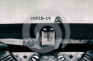 Covid-19 text on vintage typewriter