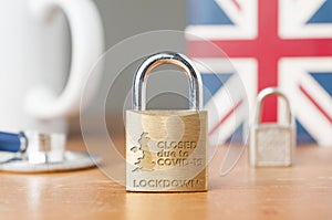 Covid-19 UK lockdown concept. A lock with the message