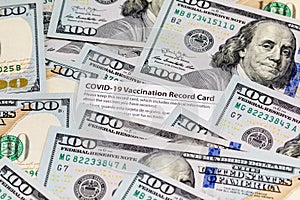 Covid-19 vaccination card and cash money