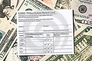 Covid-19 vaccination card and cash money - Image