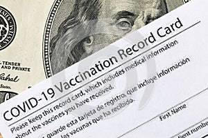 Covid-19 vaccination card and cash money - Image