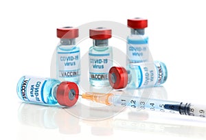 Covid 19 vaccine. Medical ampoules and syringe isolated