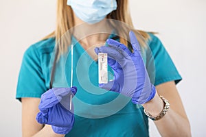 COVID-19 virus disease diagnostic,doctor holding Coronavirus test cassette,rapid strep RST kit,quick antigen detection testing