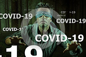 Covid-19 virus outbreak concept on young scared blindfolded man lost in the dark and confused on the load of fake news and