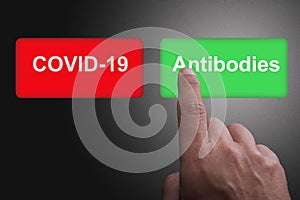 COVID-19 Virus Vaccine discovery or antibodies research success concept, Red and green buttons with Covid-19 and antibodies text