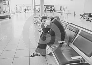 COVID-19. Woman stuck in a foreign country waiting at airport to be evacuated and return home