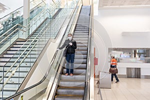 COVID-19. Woman stuck in a foreign country waiting at airport to be evacuated and return home