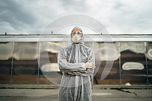 COVID-19 coronavirus doctor in hazmat suit.Infectious disease pandemic medical worker.Female physician in uniform on frontline, photo