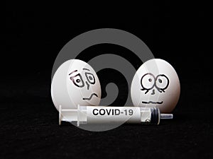 Covid-19 and coronavirus eggs drawn frightened faces alcohol syringe photo