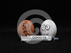 Covid-19 and coronavirus eggs drawn frightened faces alcohol syringe photo