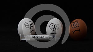 Covid-19 and coronavirus eggs drawn frightened faces alcohol syringe photo