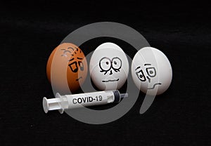 Covid-19 and coronavirus eggs drawn frightened faces alcohol syringe photo
