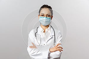 Covid19, coronavirus, healthcare and doctors concept. Portrait of professional confident young asian doctor in medical
