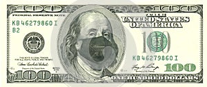 COVID-19 coronavirus in the US, $ 100 bill with face mask. COVID-19 affects the global economic market. photo