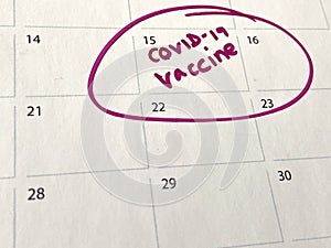 Covid-19 coronavirus vaccine shot jab appointment calendar background with copy space, many people worldwide waiting for covid-19 photo