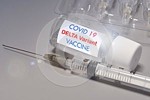 Covid-19 Delta variant strain vaccine. Syringe and vaccine. Treatment for coronavirus covid-19 photo