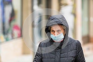 Covid-19 flu disease virus spreading in Europe. People wearing medical mask against coronavirus, influenza viruses and diseases.