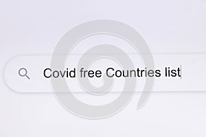 Covid free Countries list - pc screen internet browser search engine bar typing pandemic related question. Typing the